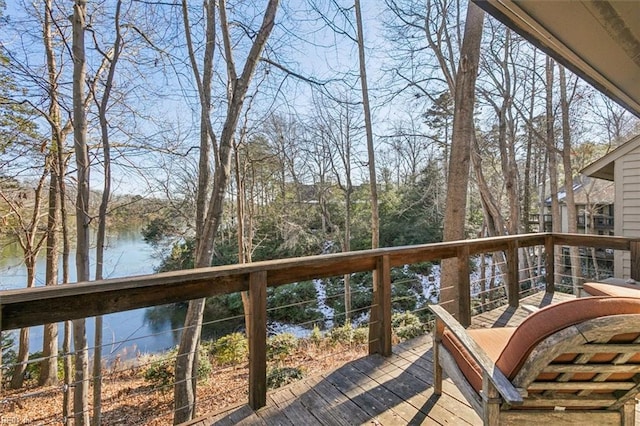 wooden terrace with a water view