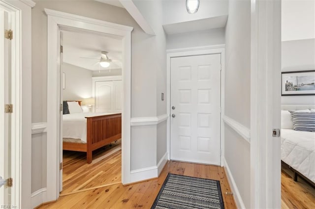 doorway featuring ceiling fan and light wood-type flooring