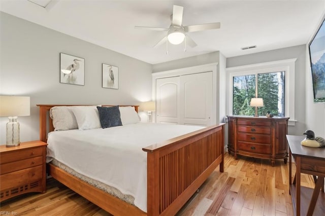 bedroom featuring a closet, ceiling fan, and light hardwood / wood-style floors