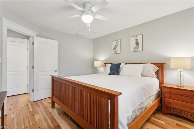 bedroom with ceiling fan and light hardwood / wood-style floors