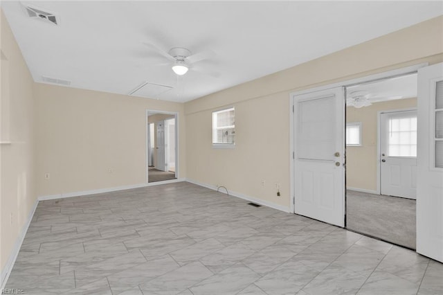 spare room featuring ceiling fan