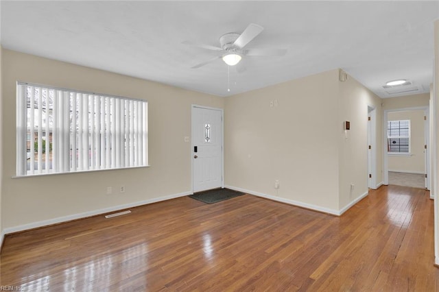 spare room featuring ceiling fan and light wood-type flooring