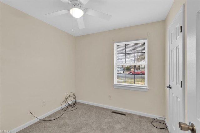 unfurnished room featuring ceiling fan and light colored carpet