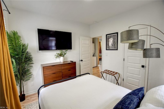 bedroom with light hardwood / wood-style floors