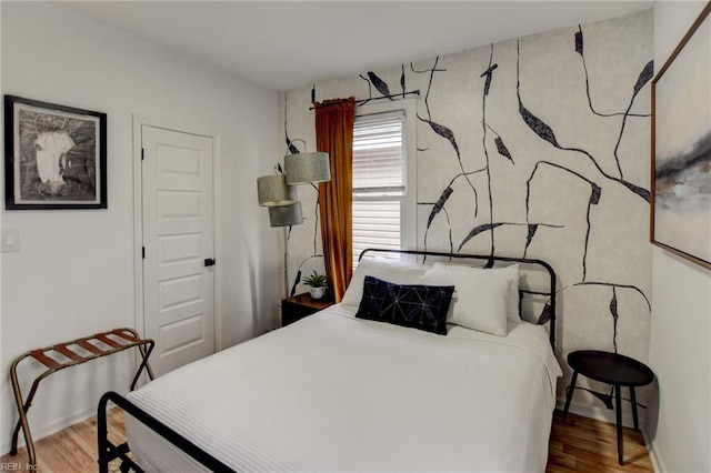 bedroom featuring wood-type flooring