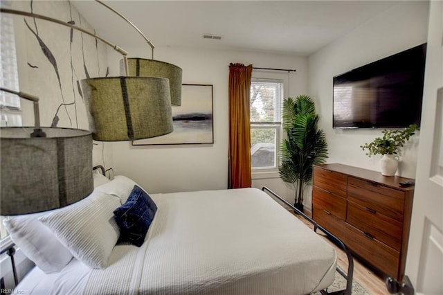 bedroom featuring hardwood / wood-style floors