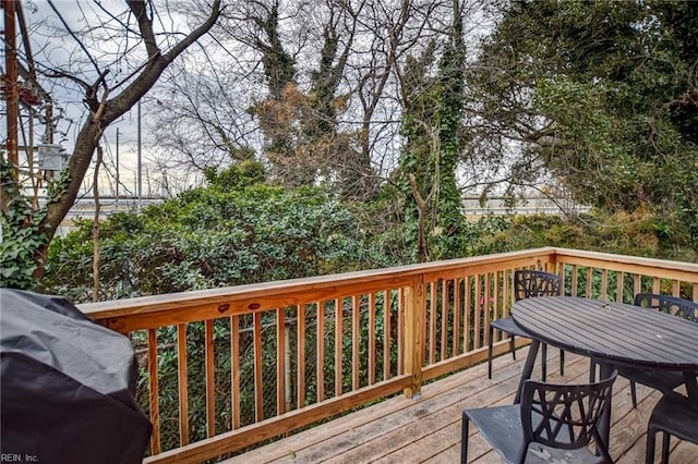 wooden terrace with area for grilling