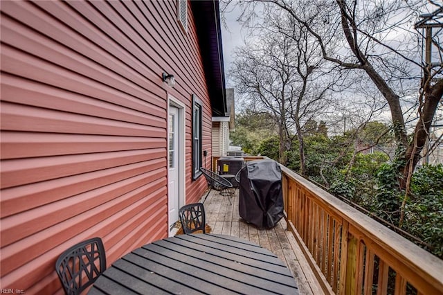 wooden balcony featuring a wooden deck and area for grilling