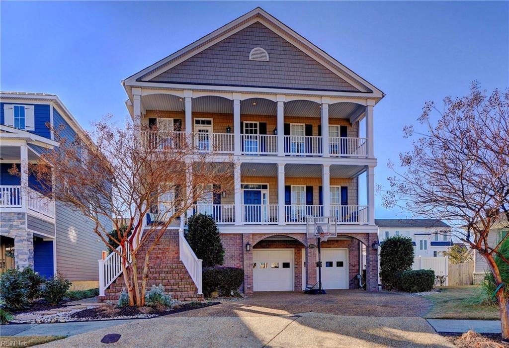 view of front of house featuring a garage and a balcony