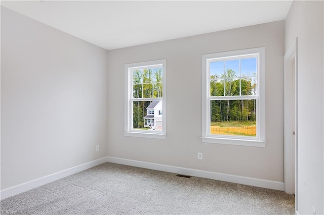 empty room featuring carpet flooring