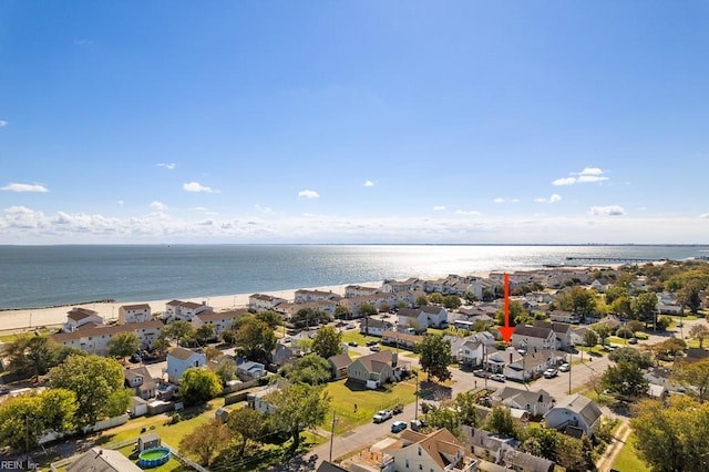 birds eye view of property with a beach view and a water view