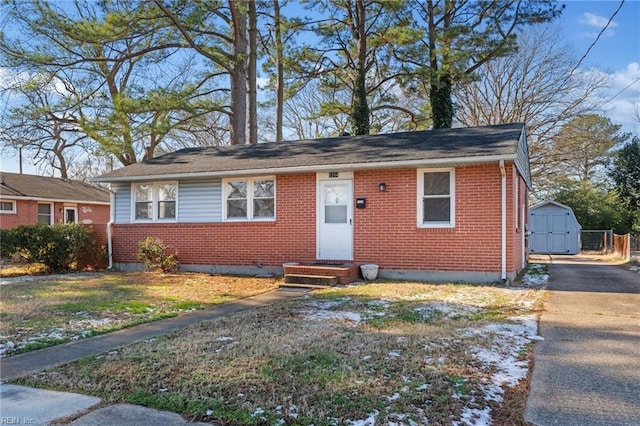 view of front of home with a shed