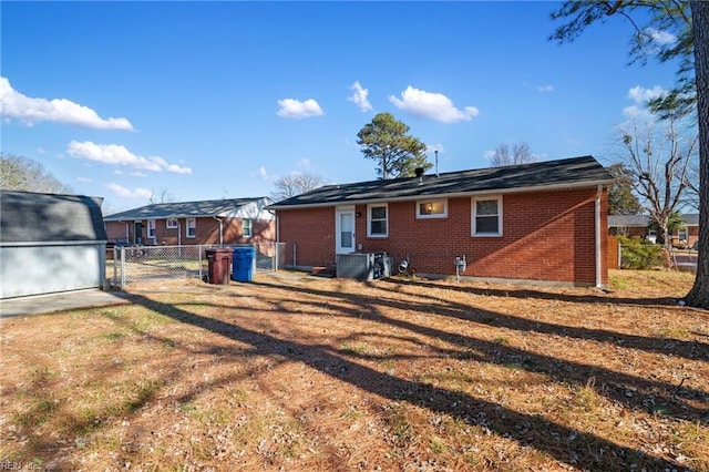 rear view of house with a yard