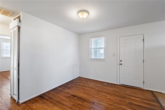 foyer entrance featuring dark hardwood / wood-style floors