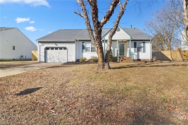 view of front of property featuring a front yard and a garage