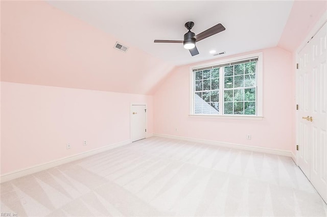 bonus room with ceiling fan, light colored carpet, and vaulted ceiling