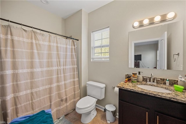 bathroom featuring a shower with shower curtain, hardwood / wood-style floors, vanity, and toilet