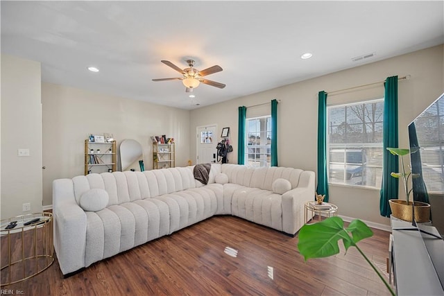 living room with ceiling fan and hardwood / wood-style floors