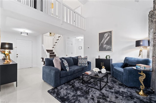 tiled living room featuring a towering ceiling