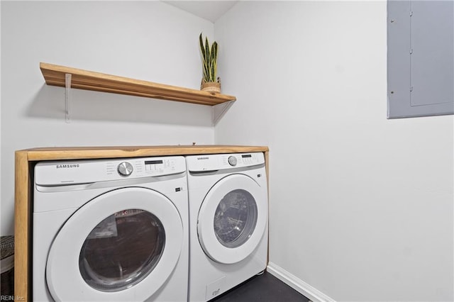 laundry area featuring electric panel and washer and dryer