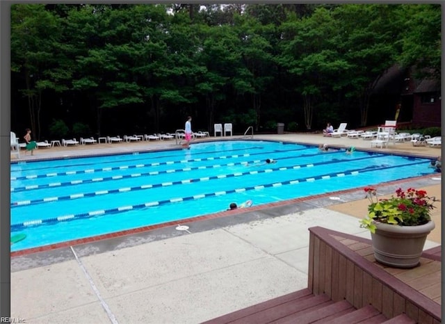 view of swimming pool featuring a patio area