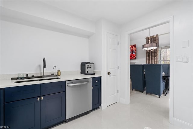 kitchen featuring sink, a notable chandelier, blue cabinets, and stainless steel dishwasher