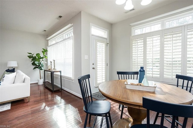 dining area with dark wood-type flooring