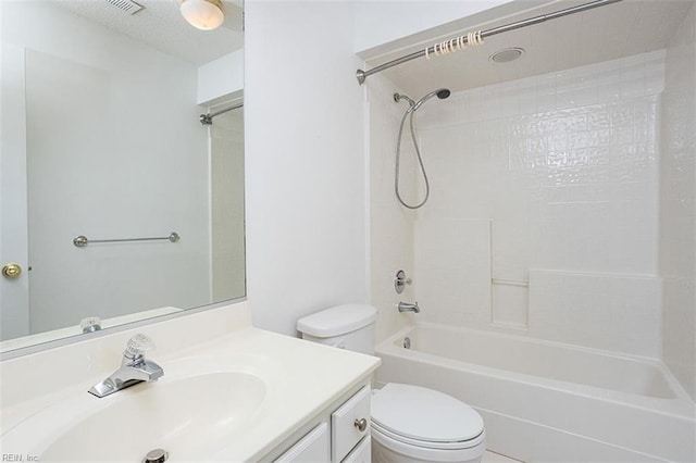 full bathroom featuring toilet, vanity, and  shower combination