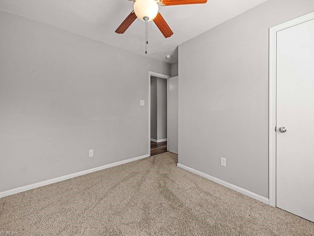 unfurnished bedroom with ceiling fan and carpet