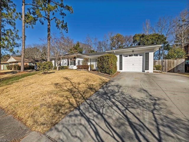 ranch-style home with a garage and a front yard