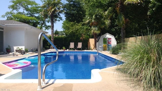 view of pool with a storage unit