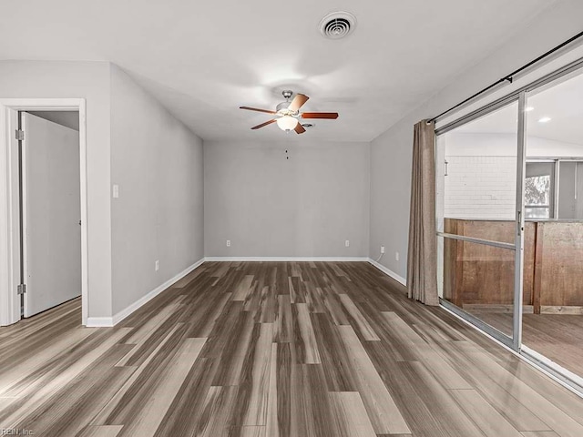 unfurnished room featuring dark hardwood / wood-style flooring and ceiling fan