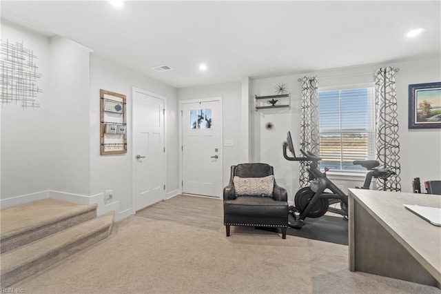 foyer with light carpet