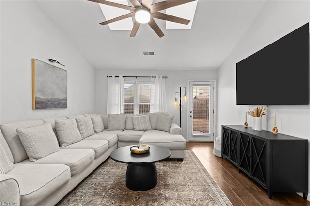 living room featuring ceiling fan, dark hardwood / wood-style flooring, and lofted ceiling