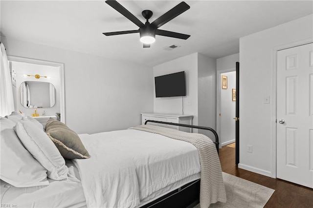 bedroom with ceiling fan and dark hardwood / wood-style floors