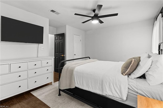 bedroom featuring ceiling fan and hardwood / wood-style flooring