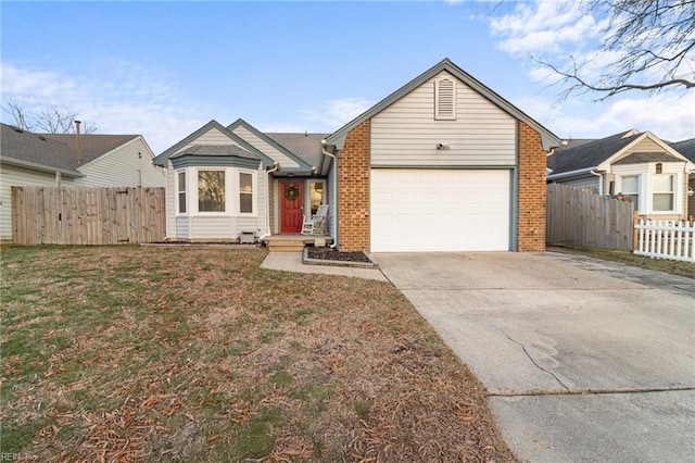 view of front of property with a front yard and a garage