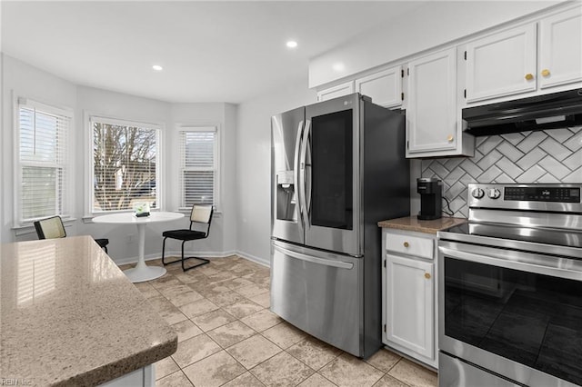 kitchen featuring white cabinetry, light tile patterned floors, stainless steel appliances, and tasteful backsplash