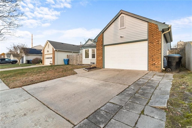 view of front of house featuring a garage and a front lawn