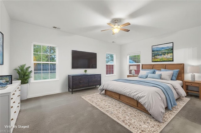 bedroom with ceiling fan and carpet