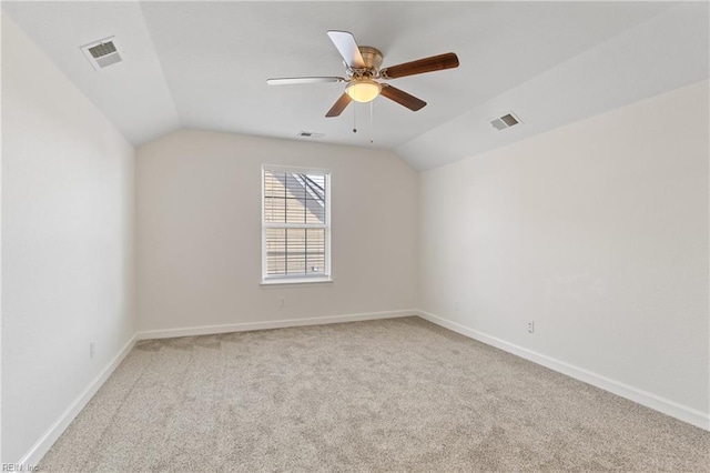 additional living space featuring lofted ceiling, ceiling fan, and light carpet