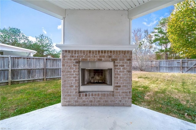 view of patio with exterior fireplace