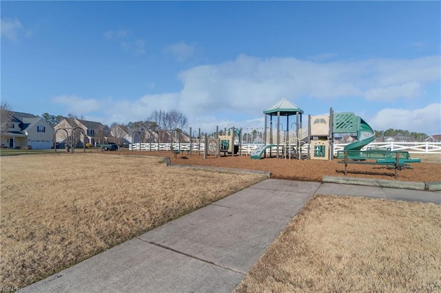 view of playground with a lawn