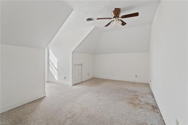 bonus room featuring ceiling fan, light carpet, and lofted ceiling