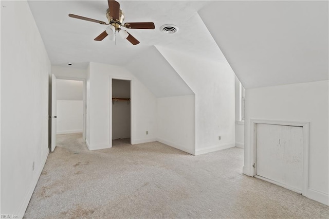 bonus room featuring lofted ceiling, light carpet, and ceiling fan