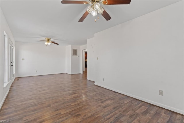 unfurnished room with ceiling fan and dark hardwood / wood-style floors