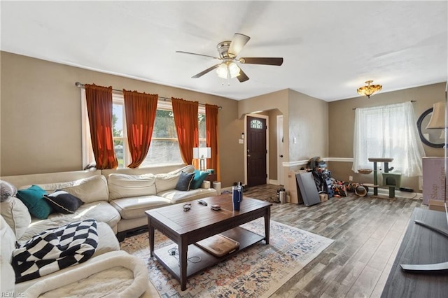 living room with ceiling fan and wood-type flooring