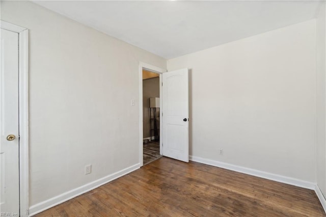 unfurnished room featuring wood-type flooring