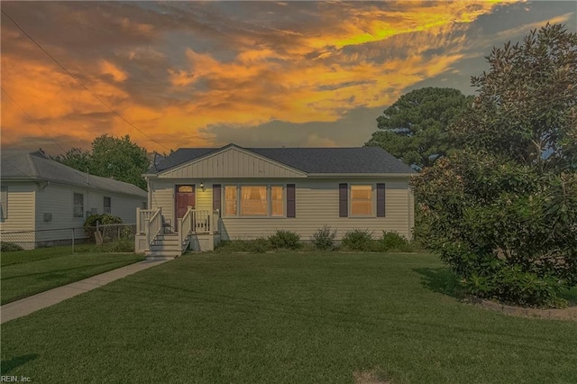 view of front of home with a yard