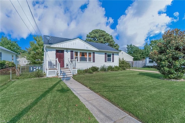 bungalow-style home with a front lawn